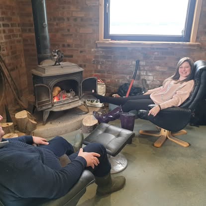 Relaxing by the wood burner at Elliott Clays lodge, Birkhill Castle Estate, Fife