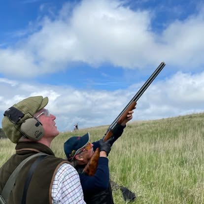 One-to-one shotgun tuition at Elliott Clays — instructor guiding a beginner, Birkhill Fife